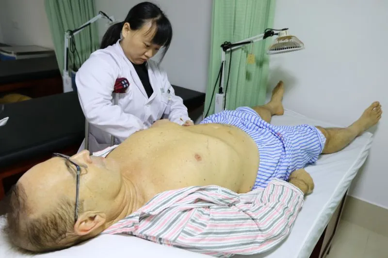 A photo of me with the acupuncture doctor in Changsha, China, 2015.